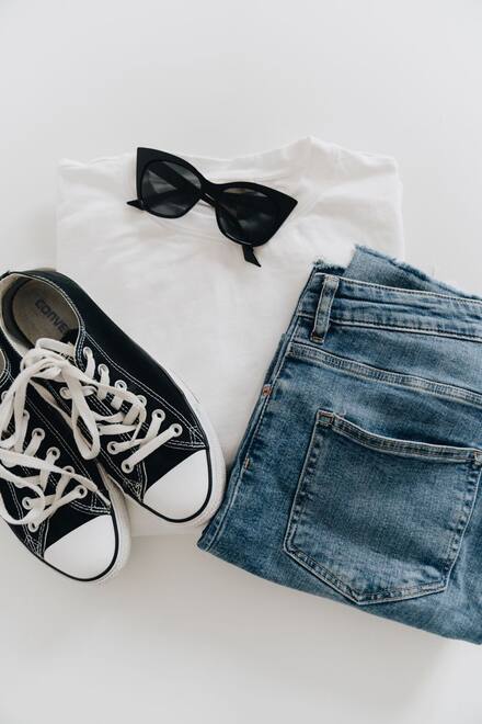 Sneakers with jeans and sunglasses
