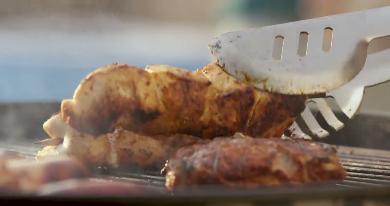 Grilled meats turned over the charcoal
